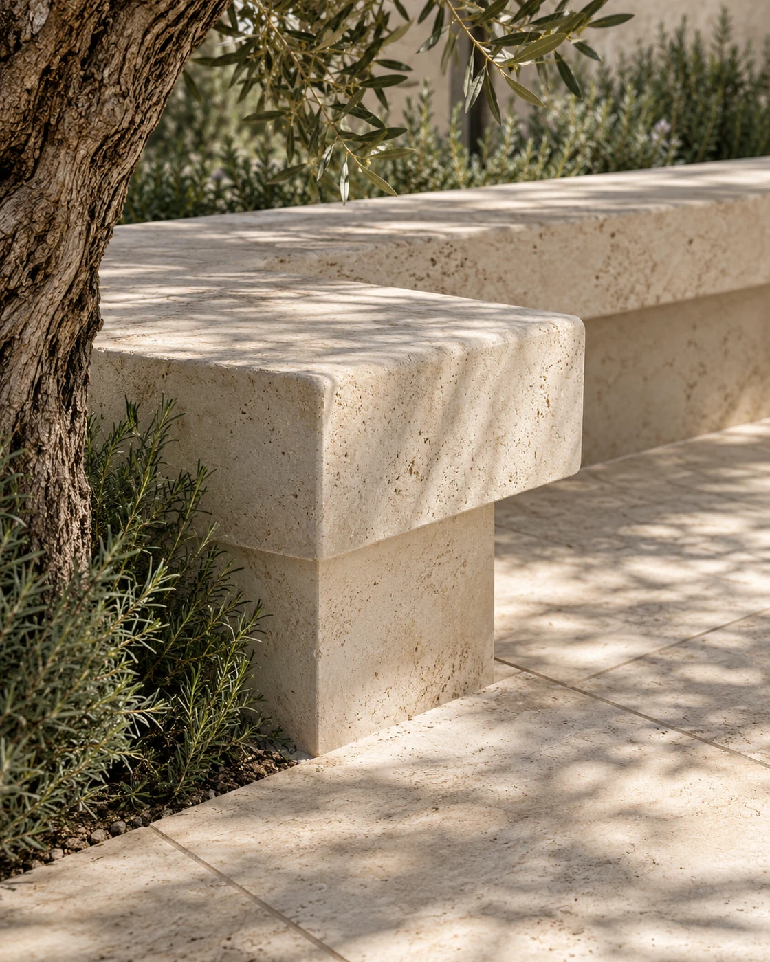 Illustrative detail of limestone seating and olive foliage in a private garden